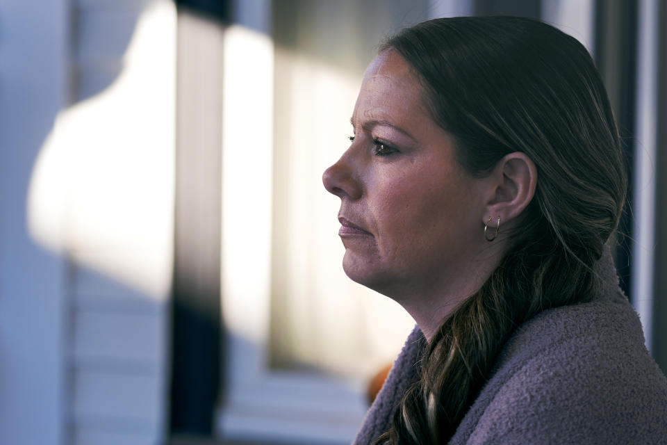 Kristina Amyot sits on the porch of a sober-living home, where she resided for about two years, at the Hope on Haven Hill, a residential, outpatient and recovery support service provider for pregnant, post-partum and parenting women, Friday, Jan. 12, 2024, in Rochester, N.H. Amyot, 36, spent more than half her life struggling with addiction, mainly to heroin. Drug overdose deaths in New Hampshire have increased in recent years, and some residents want to hear more from the presidential candidates about how they'd help. (AP Photo/Charles Krupa)