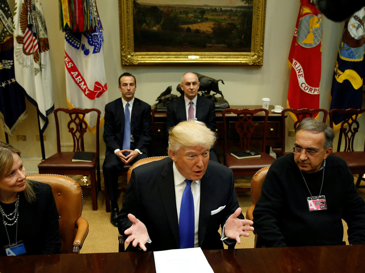 Flanked by General Motors CEO Mary Barra, left, and Fiat Chrysler CEO Sergio Marchionne, right, Donald Trump hosts a meeting with US auto industry bosses at the White House: Reuters