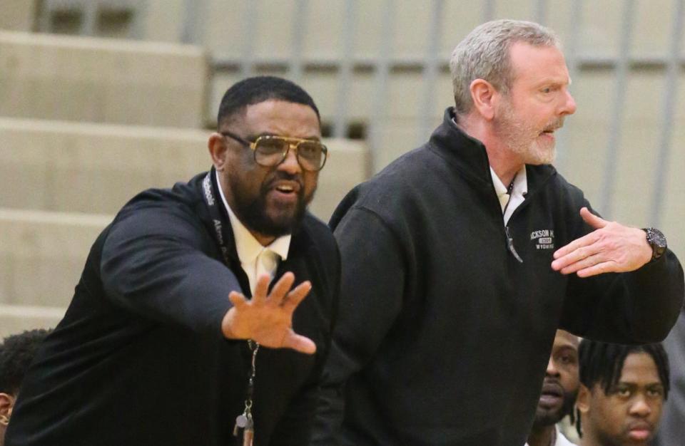 Buchtel head coach Rayshon Dent (left) and assistant coach Steve Culp direct their players during a 2023 Division II district semifinal at Stow.