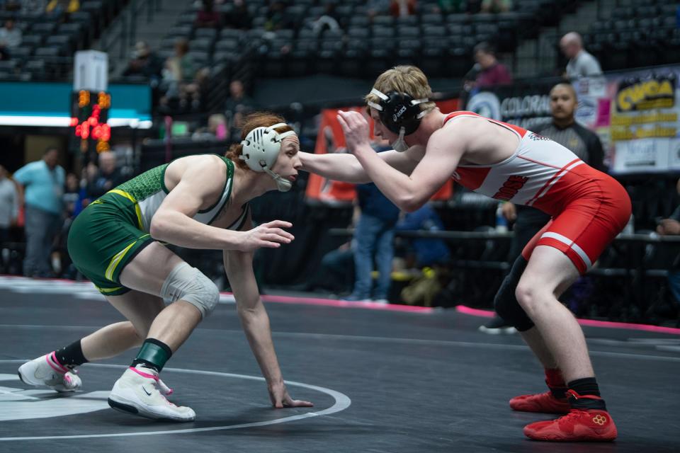 Pueblo County's Thomas Velasquez, left, faces off with Holden Putnam of Montrose during their Class 4A 132-pound first-round matchup of CHSAA state wrestling tournament on Thursday, February, 15, 2024.