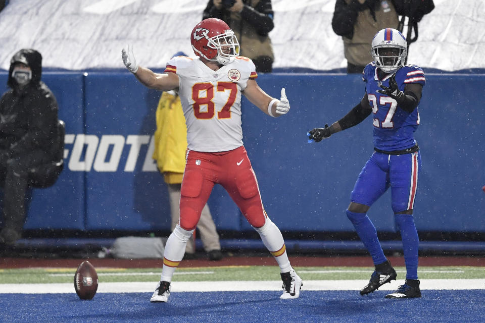 Kansas City Chiefs' Travis Kelce, left, celebrates his touchdown as Buffalo Bills' Tre'Davious White, right, looks on, during the first half of an NFL football game, Monday, Oct. 19, 2020, in Orchard Park, N.Y. (AP Photo/Adrian Kraus)