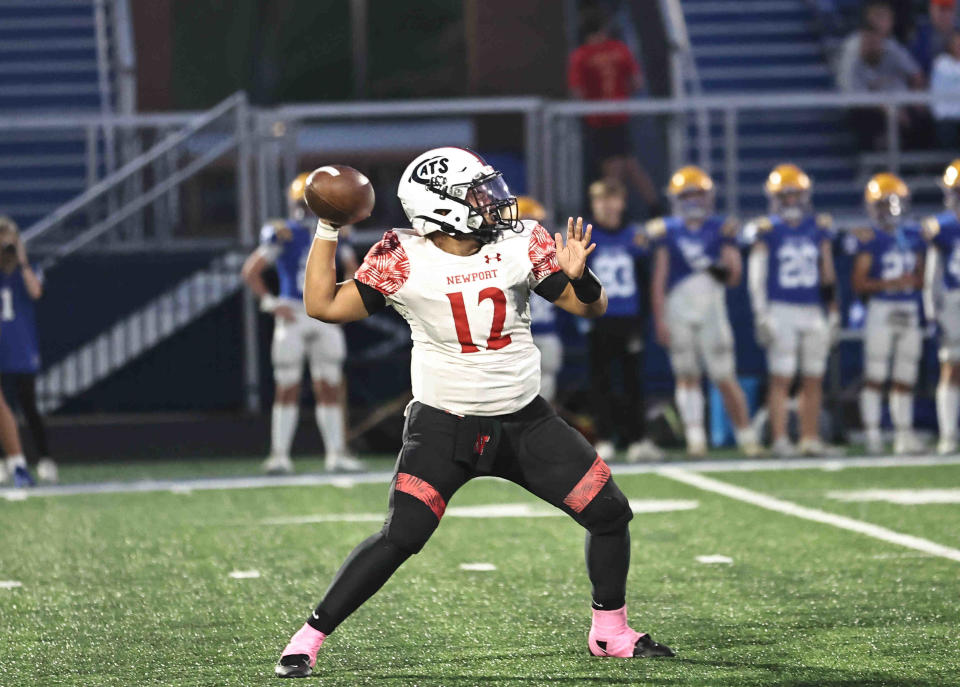 Newport quarterback Kyle Lee (12) passes the ball during their 22-6 loss to Newport Central Catholic Friday, Oct. 6, 2023.