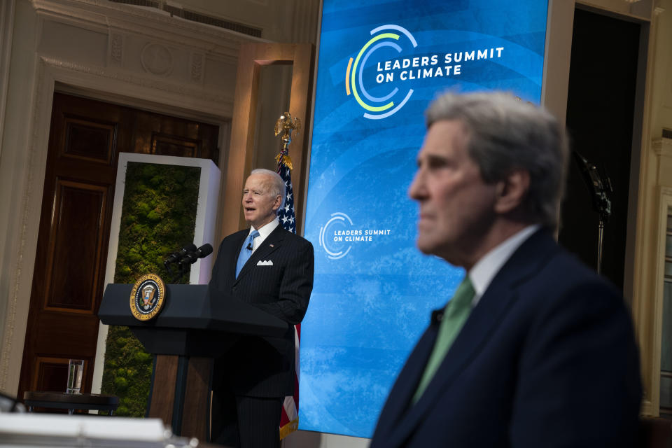 Special Presidential Envoy for Climate John Kerry listens as President Joe Biden speaks to the virtual Leaders Summit on Climate, from the East Room of the White House, Friday, April 23, 2021, in Washington. (AP Photo/Evan Vucci)