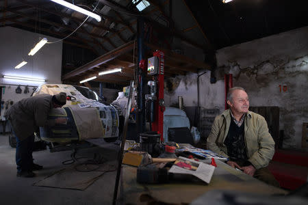 Mervyn Johnson who owns a garage poses for a photograph in the border town of Pettigo, Northern Ireland, February 20, 2018. "I've been here since 1956, it was a bit of a problem for a few years. My premises has been blown up about six or seven times, we just kept building and starting again" Johnson said laughing. "We just got used to it (the hard border) really but now that it's gone, we wouldn't like it back again".