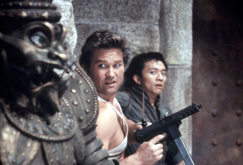 Kurt Russell and Dennis Dun hide from imminent danger in &quot;Big Trouble in Little China&quot;