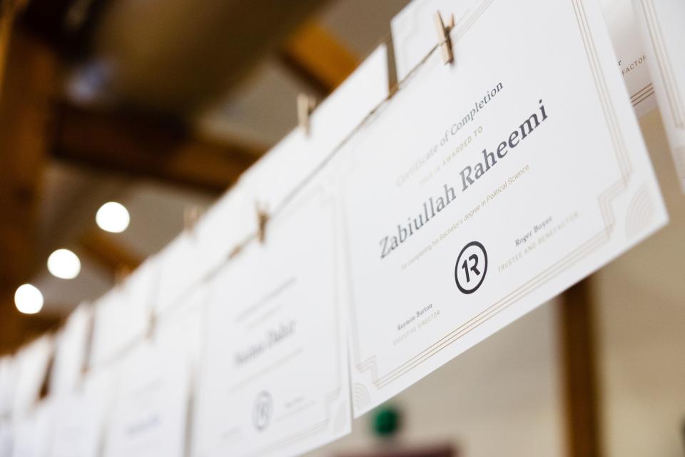 Certificates with graduates’ names hang during the One Refugee graduation celebration at the Garden Place at Heritage Park in Salt Lake City on May 8, 2023. | Ryan Sun, Deseret News