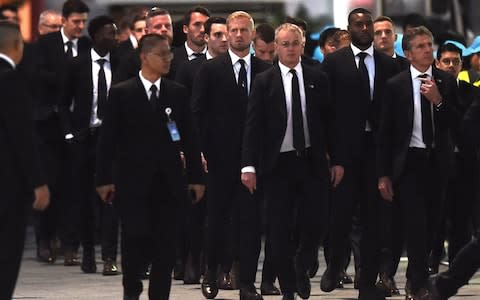 Leicester City's players arrive at Wat Thepsirin Buddhist temple in Bangkok - Credit: afp