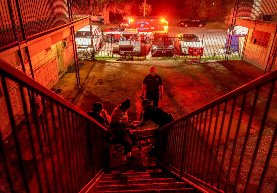 Image: Houston Fire Department EMS medics transport a Covid-positive patient to a hospital in Texas on Aug. 20, 2021. The Delta variant was overwhelming area hospitals. (John Moore / Getty Images file)