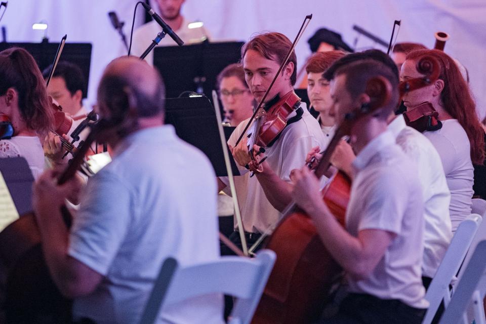 The Tallahassee Symphony Orchestra plays for a crowd of hundreds at Tom Brown Park for the Fourth of July celebration Sunday, July 4, 2021.