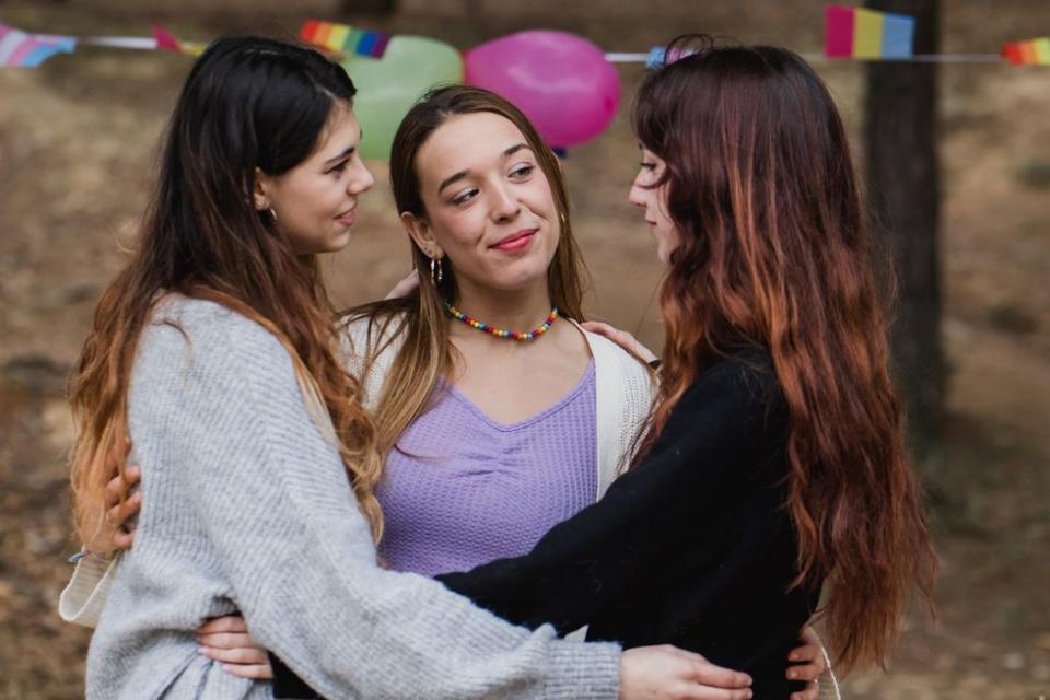 three women hugging