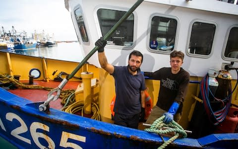 Fishermen Callum Clark and Nathan Clark onboard Joanna C at the Brixham Harbour in Devon after they were attacked - Credit: SWNS.com 