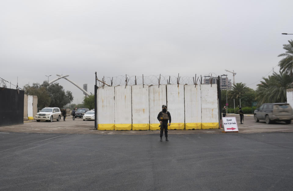 Iraqi security forces stand guard as they check motorists entering the Green Zone, in Baghdad, Iraq, Sunday, Jan. 8, 2023. (AP Photo/Hadi Mizban)