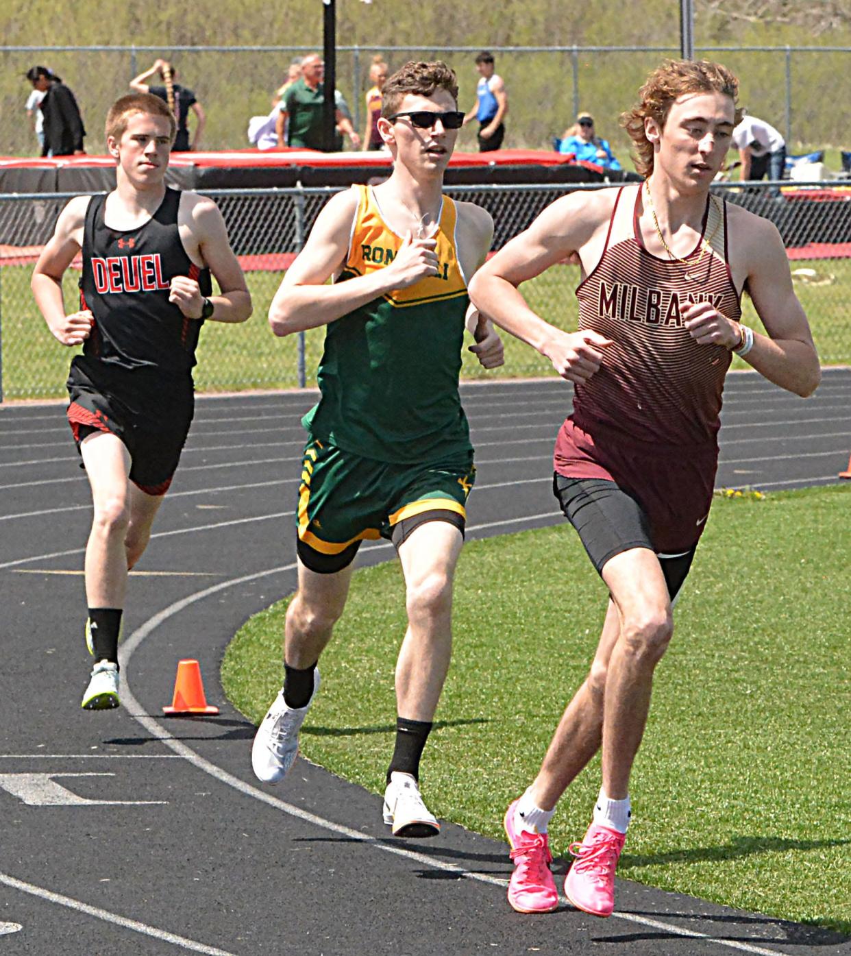 Milbank's Payton Brown, Aberdeen Roncalli's Joe Perkins and Deuel's Tyson Hagberg are pictured in the boys' 1,600-meter run during the Northeast Conference track and field meet on Thursday, May 9, 2024 at Sisseton. Brown took first, Perkins second and Hagberg fourth.