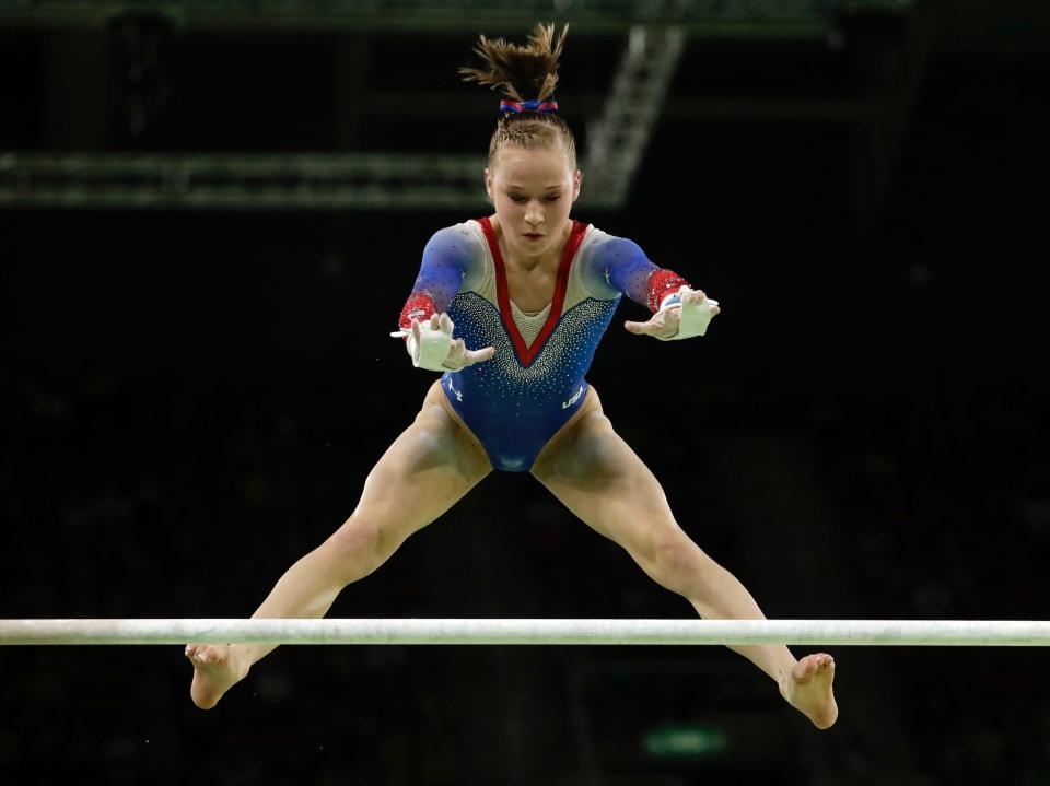 Madison Kocian competes on the uneven bars.