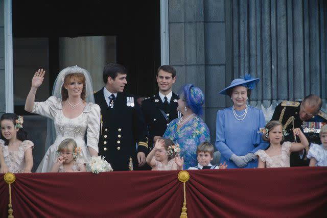 <p>Fox Photos/Hulton Archive/Getty</p> Queen Elizabeth wears blue at Prince Andrew's wedding in 1986