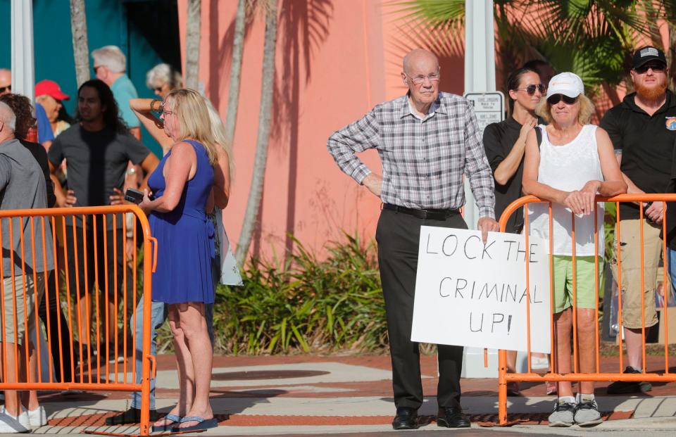 Fort Myers resident Tom Donahue holds a sign in disapproval of former President Donald J. Trump. Trump visited downtown Fort Myers Friday for the Lee County Republican Party's 2023 Lincoln Reagan Dinner at the Caloosa Sound Convention Center. Supporters and protestors gathered outside before and during the event.
