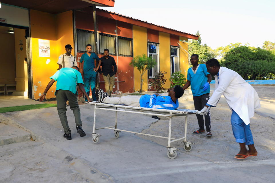 Paramedics at the Madina hospital push a gurney with a civilian injured in a car bomb explosion in the Kilometre 4 area of Mogadishu, Somalia.