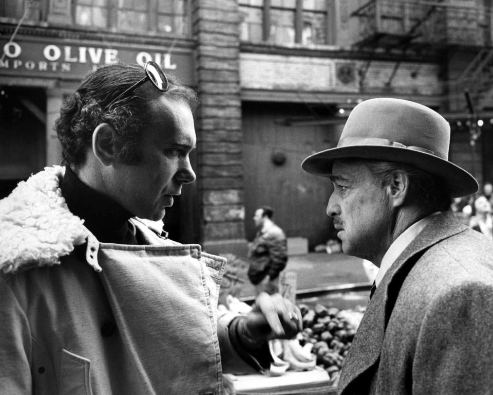 Producer Albert S. Ruddy (left) and actor Marlon Brando (1924 - 2004) on the set of 'The Godfather', directed by Francis Ford Coppola, Little Italy, Manhattan, New York City, 1972. (Photo by Silver Screen Collection/Getty Images) 