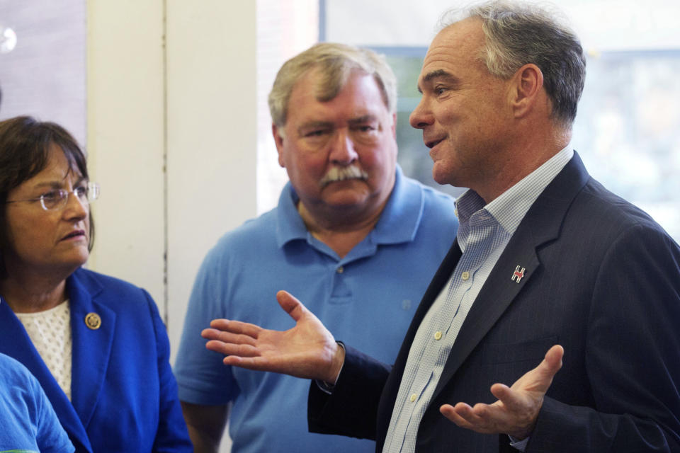 FILE - Former Democratic N.H. House Speaker Steve Shurtleff, center, listens to then-Democratic vice presidential candidate Sen. Tim Kaine, D-Va., right, during a campaign stop, Aug. 12, 2016, in Concord, N.H. Democrats across New Hampshire are especially upset with President Joe Biden for undermining New Hampshire's status as the first-in-the-nation presidential primary state. But their concerns about Biden run much deeper, in line with a majority of Democratic voters nationwide, who oppose the 80-year-old president's plans to launch his reelection campaign in the coming weeks. At left is Rep. Annie Kuster, D-N.H. (AP Photo/Jim Cole, File)