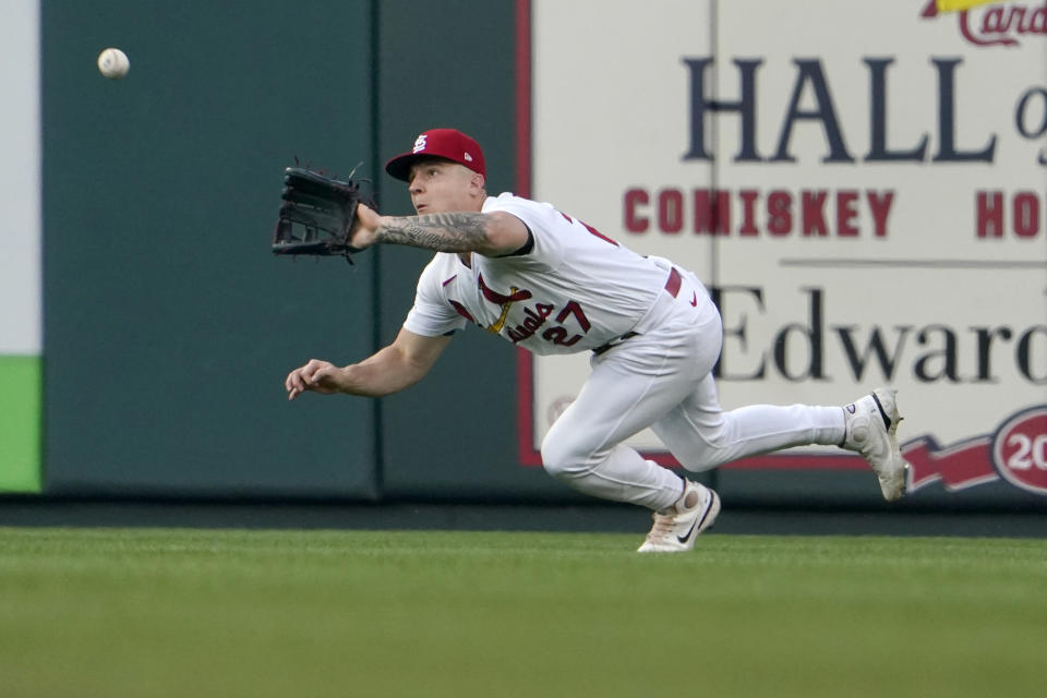 FILE - St. Louis Cardinals center fielder Tyler O'Neill dives to catch a fly ball by Washington Nationals' Lane Thomas for an out during the first inning of a baseball game against the Washington Nationals Wednesday, Sept. 7, 2022, in St. Louis. The Boston Red Sox acquired O’Neill from the Cardinals on Friday, Dec. 8. ,2023, bringing in a two-time Gold Glove winner to replace the departing Alex Verdugo. (AP Photo/Jeff Roberson, File)