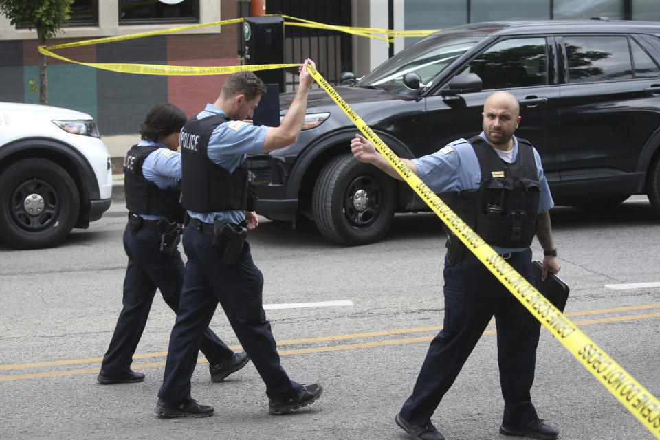 Chicago police investigate in the 1300 block of West Taylor Street after officials said an officer was shot multiple times while responding to a call of a domestic disturbance in a University Village neighborhood apartment building, Friday morning, July 1, 2022, in Chicago. (Antonio Perez/Chicago Tribune via AP)