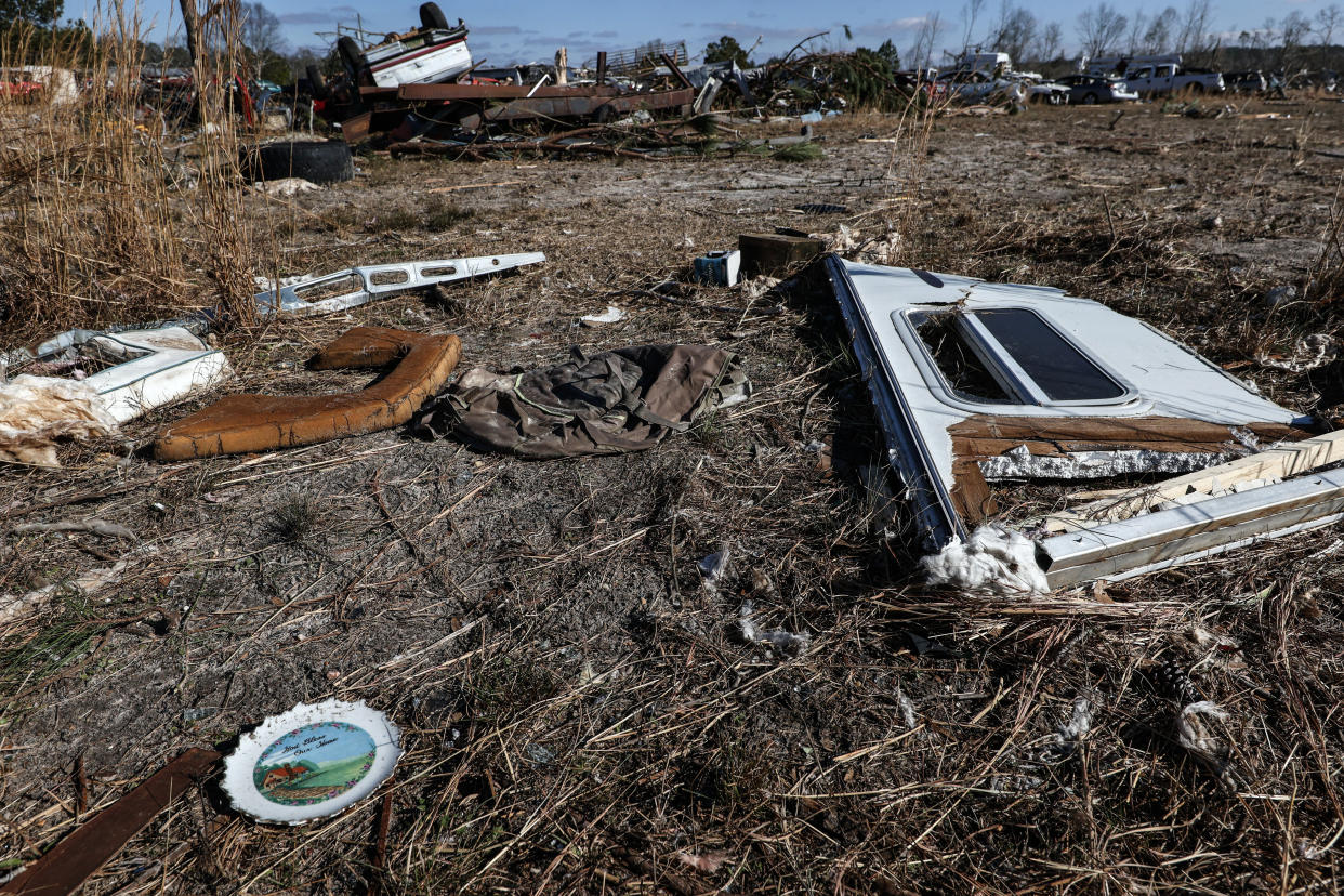Debris stretches across a field after a tornado that ripped through Central Alabama earlier this week along County Road 140 where loss of life occurred Saturday, Jan. 14, 2023 in White City, Autauga County, Ala. (AP Photo/Butch Dill)