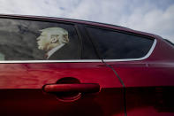 A decal of President Donald Trump sits as though he is riding in the back seat of a supporter's vehicle outside of the meeting before U.S. Rep. Elissa Slotkin speaks during a constituent town hall about her stance on articles of impeachment and address other issues on Monday, Dec. 16, 2019 in the Oakland Center at Oakland University in Rochester, Mich. (Jake May/The Flint Journal via AP)