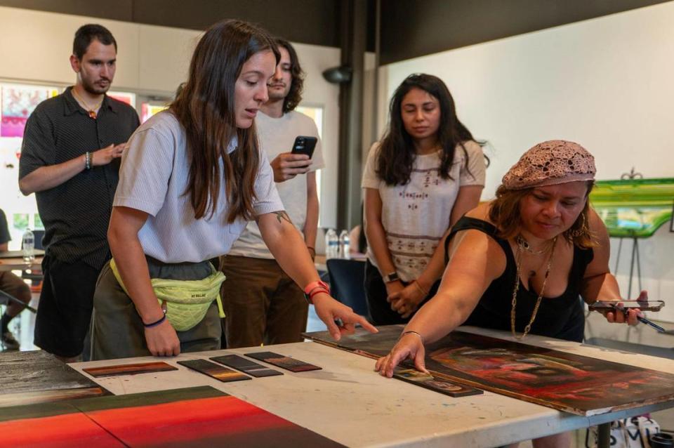 MASA members discuss art pieces from Nic Ortega during a meeting at the Mattie Rhodes Center in Kansas City. Emily Curiel/ecuriel@kcstar.com