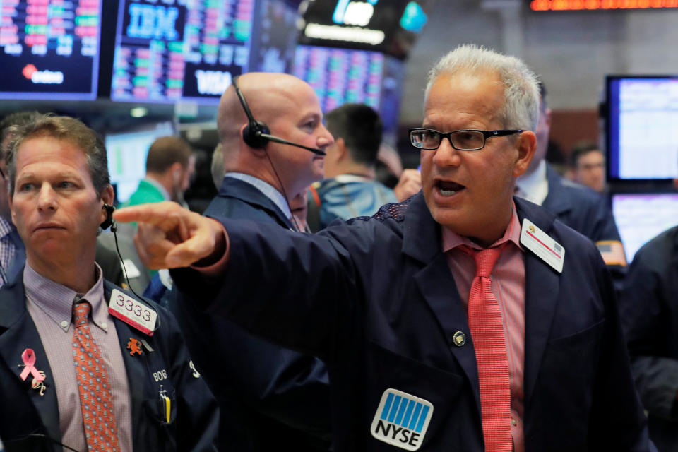 Traders work on the floor of the New York Stock Exchange (NYSE) in New York, U.S., October 11, 2018. REUTERS/Brendan McDermid