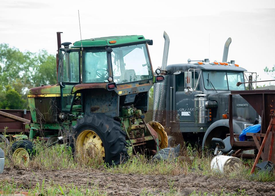 The Provosts' tractors wait silently in the mud in New Iberia, Louisiana, home to expansive sugarcane fields that stretch to the Bayou.