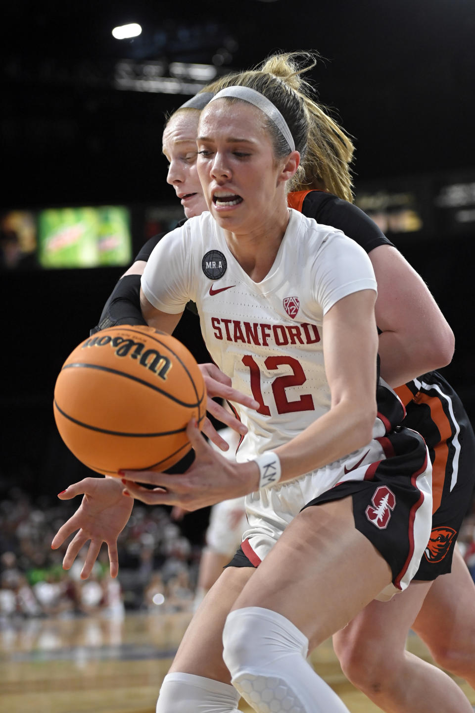 Stanford guard Lexie Hull (12) grabs a loose ball against Oregon State during an NCAA college basketball game in the quarterfinals of the Pac-12 women's tournament Thursday, March 3, 2022, in Las Vegas. (AP Photo/David Becker)