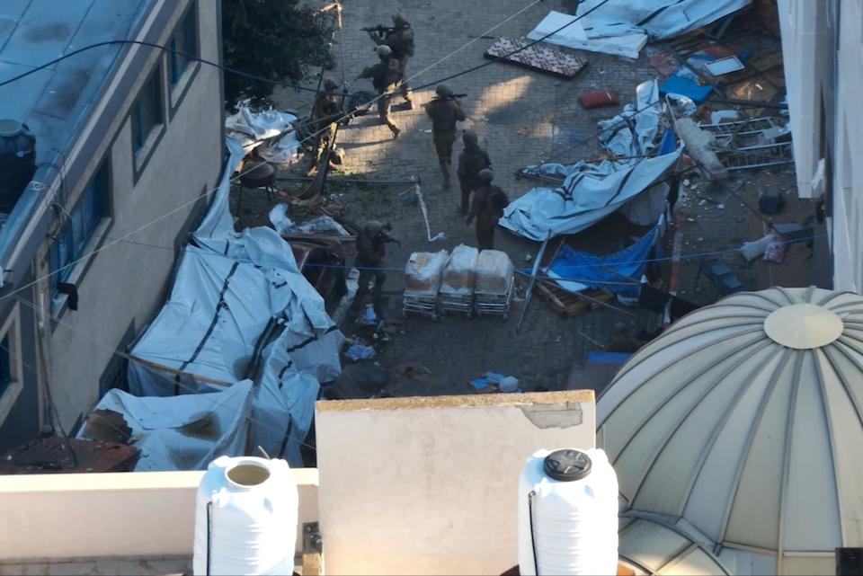 Israeli soldiers inside the al-Shifa hospital complex (via Reuters)