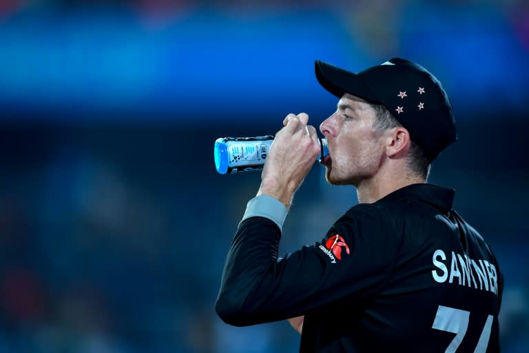 Thirsty work: <a class="link " href="https://sports.yahoo.com/soccer/teams/new-zealand-women/" data-i13n="sec:content-canvas;subsec:anchor_text;elm:context_link" data-ylk="slk:New Zealand;sec:content-canvas;subsec:anchor_text;elm:context_link;itc:0">New Zealand</a>'s Mitchell Santner takes a drinks break on Monday (Noah SEELAM)