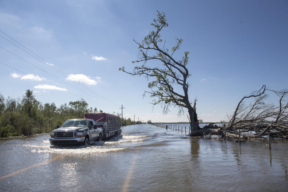 Floodwater covers a road just southeast of Lake Charles, La., following Hurricane Delta on Saturday, Oct. 10, 2020. (Chris Granger/The Advocate via AP)