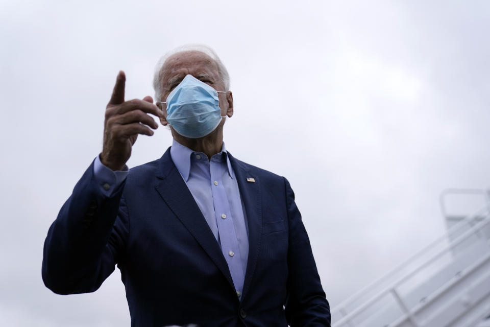 Democratic presidential candidate former Vice President Joe Biden speaks to members of the media before boarding his campaign plane at New Castle Airport, in New Castle, Del., Monday, Oct. 12, 2020, en route to Ohio. (AP Photo/Carolyn Kaster)