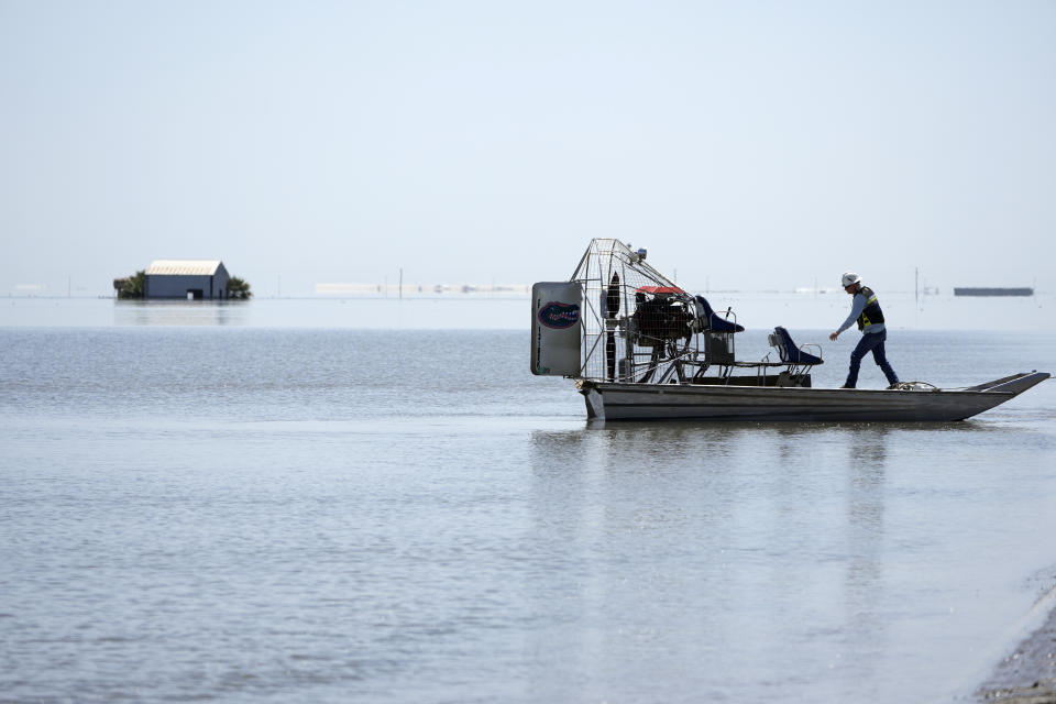 An airboat is pushed out onto Tulare Lake after a series of storms Tuesday, April 25, 2023, in Corcoran, Calif. (AP Photo/Marcio Jose Sanchez)