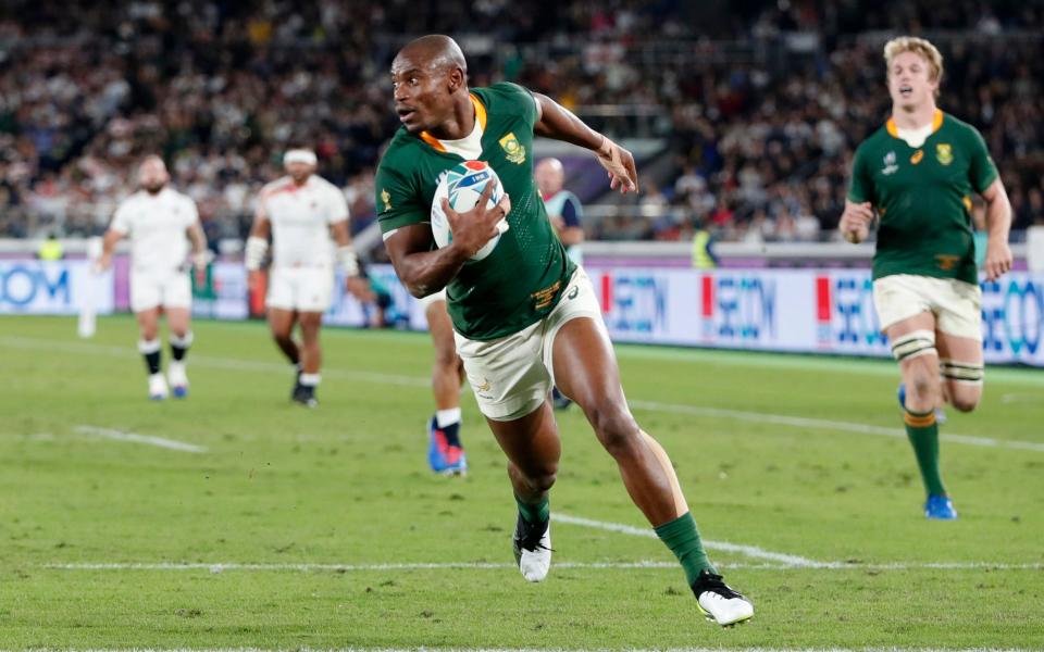 South Africa's Makazole Mapimpi runs in to score their first try. - REUTERS