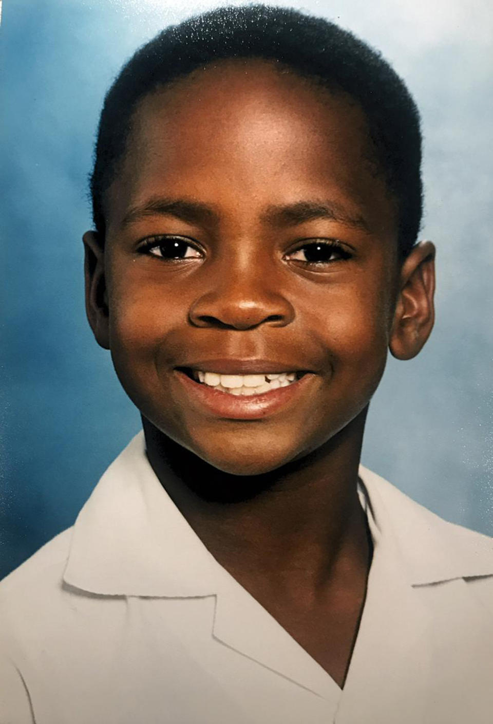 Mzi in a school photo. (Bravo)