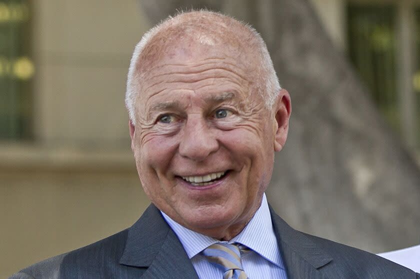 FILE - Attorney Tom Girardi smiles outside the Los Angeles courthouse on Wednesday, July 9, 2014. Disbarred and disgraced Los Angeles celebrity lawyer Tom Girardi has been indicted in Chicago on charges of stealing $3 million from clients who lost family members in the 2018 Lion Air crash. (AP Photo/Damian Dovarganes, File)