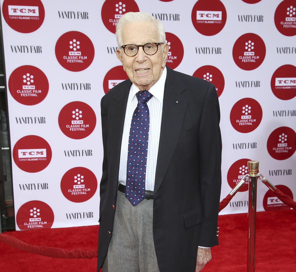 FILE - Walter Mirisch arrives at 2014 TCM Classic Film Festival's Opening Night Gala at the TCL Chinese Theatre on April 10, 2014, in Los Angeles. Mirisch, the astute and Oscar winning film producer who oversaw such classics as "Some Like It Hot," "West Side Story" and "In the Heat of the Night," has died of natural causes, the Academy of Motion Picture Arts and Sciences said Saturday, Feb. 25, 2023. He was 101. (Photo by Annie I. Bang/Invision/AP, File)