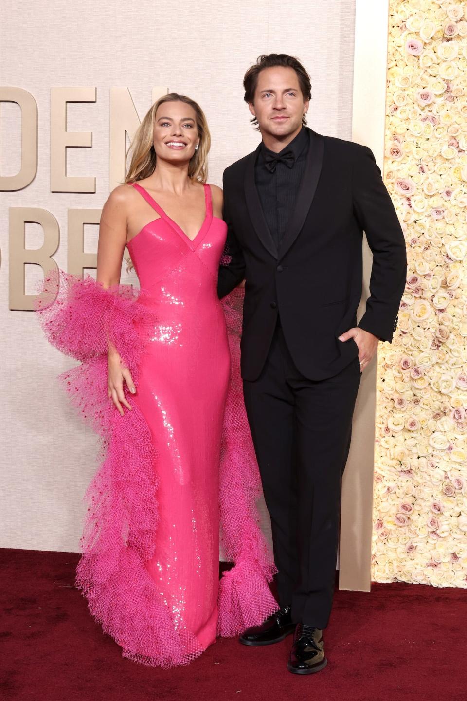 Margot Robbie and Tom Ackerley attend the 2024 Golden Globes.