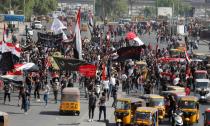 Iraqi students and activists march in Baghdad for protests anniversary, gather in Tahrir square