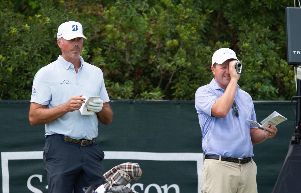 Matt Kuchar, left, and his caddie size up the 10th hole during a practice round at the Sanderson Farms Championship at the Country Club of Jackson in Jackson, Miss., Tuesday, Oct. 1, 2024.