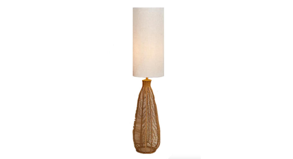 The natural woven string base on this bohemian-inspired lamp is a unique addition.