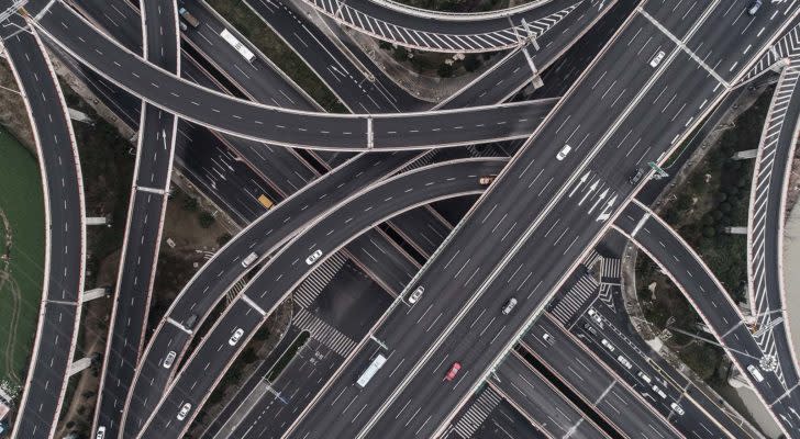 A series of roads and overpasses connect in an aerial view. best infrastructure stocks