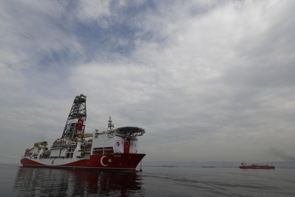 Turkey's 230-meter (750-foot) drillship 'Yavuz' crosses the Marmara Sea on its way to the Mediterranean, from the port of Dilovasi, outside Istanbul, Thursday, June 20, 2019. Turkey had launched Yavuz, that it says will drill for gas off neighboring Cyprus despite European Union warnings to refrain from such illegal actions that could incur sanctions against Ankara.(AP Photo/Lefteris Pitarakis)