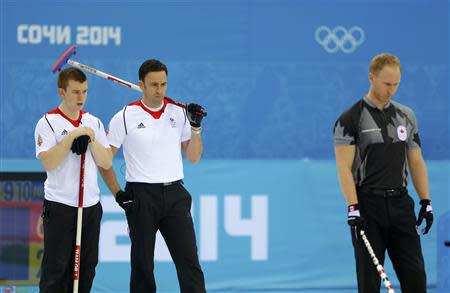 (L-R) Britain's vice Greg Drummond, Britain's skip David Murdoch and Canada's skip Brad Jacobs look on during their men's curling gold medal game at the 2014 Sochi Olympics in the Ice Cube Curling Center in Sochi February 21, 2014. REUTERS/Laszlo Balogh