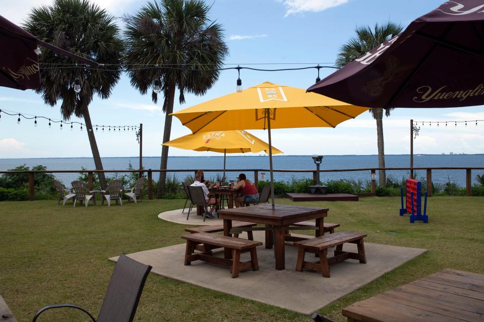 Diners enjoy a one of a kind view of Escambia bay with dining at Calvet's in the Heights on Wednesday June 7, 2023. 