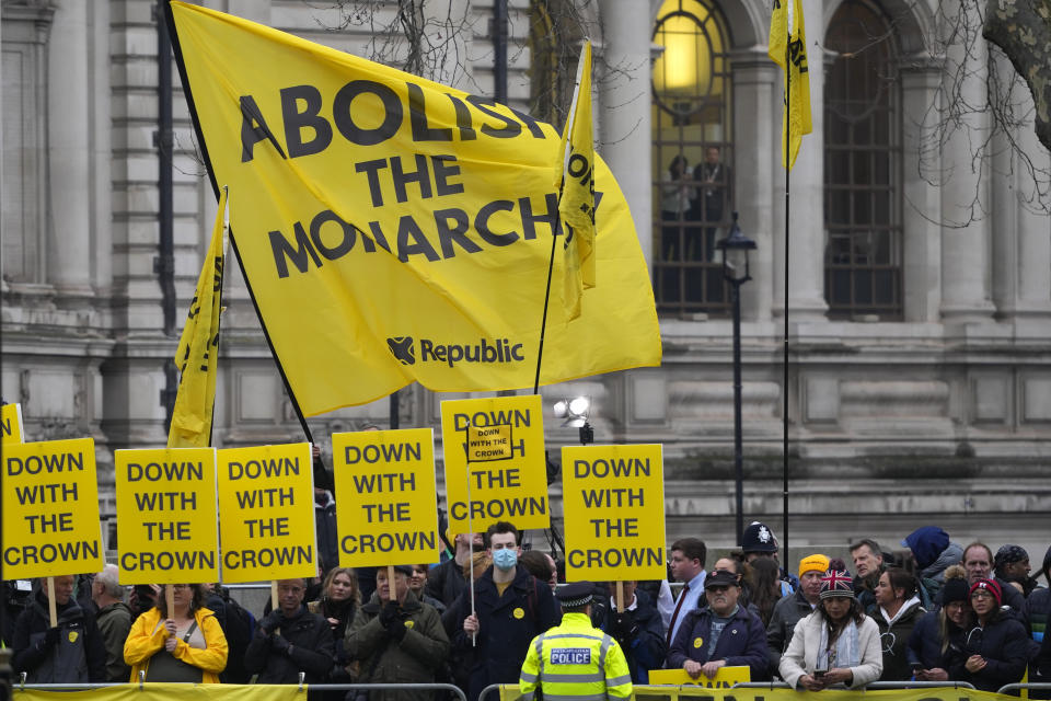 Anti-monarchy protesters demonstrate outside Westminster Abbey watched by police before members of the Royal family arrive to attend the annual Commonwealth Day Service of Celebration at Westminster Abbey in London, Monday, March 11, 2024. Commonwealth Day is an annual celebration observed by people all over the Commonwealth in Africa, Asia, the Caribbean and Americas, the Pacific and Europe. (AP Photo/Kirsty Wigglesworth)