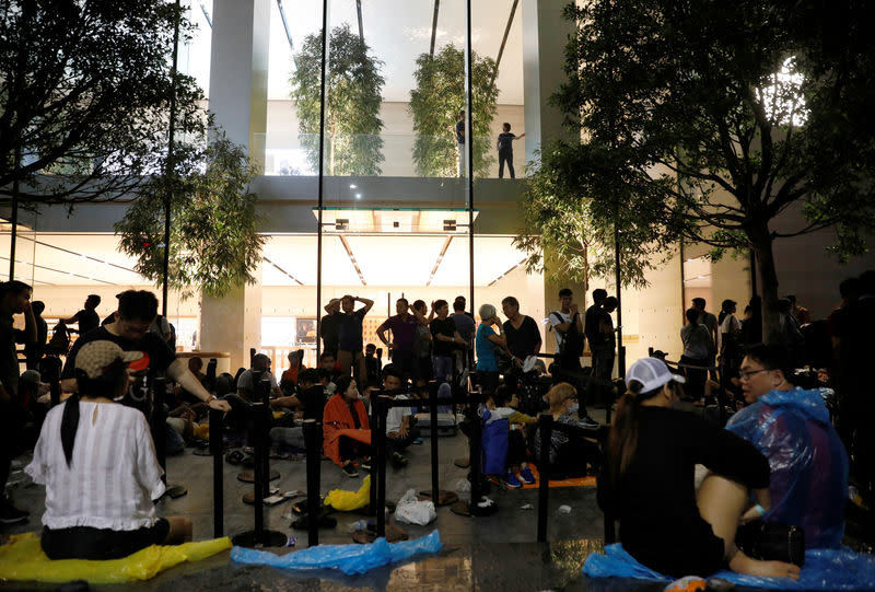 People queue overnight for the iPhone X launch outside the Apple store in Singapore